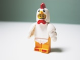 LEGO chicken minifig on table