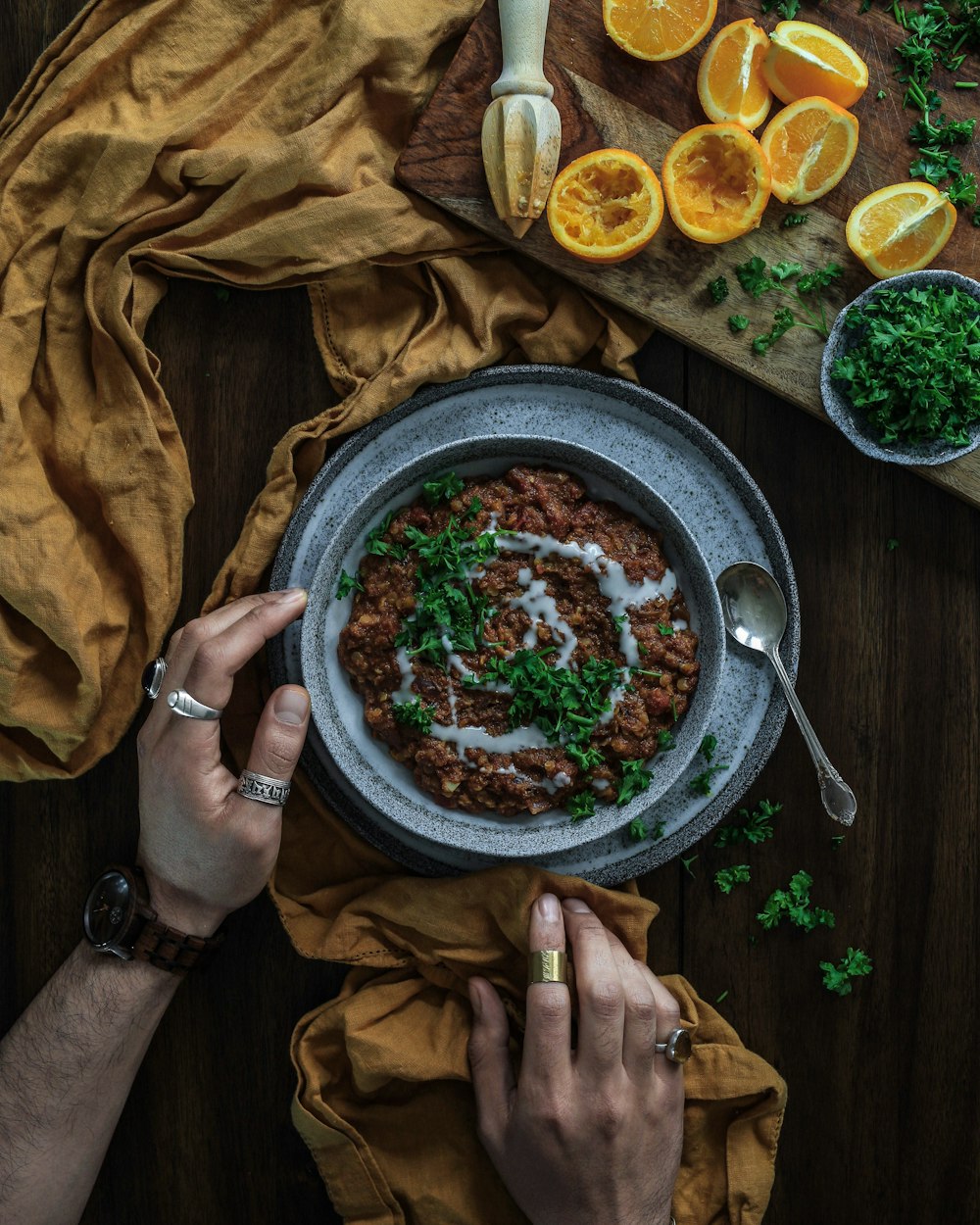 food with white sauce in gray bowl