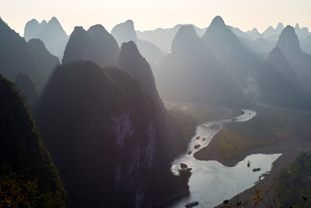 silhouette of rock formation and river during daytime