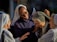 A group of nuns are gathered together, smiling and engaging in conversation. They appear to be enjoying each other's company, sharing a moment of joy and camaraderie. The setting suggests a sense of community and friendship.