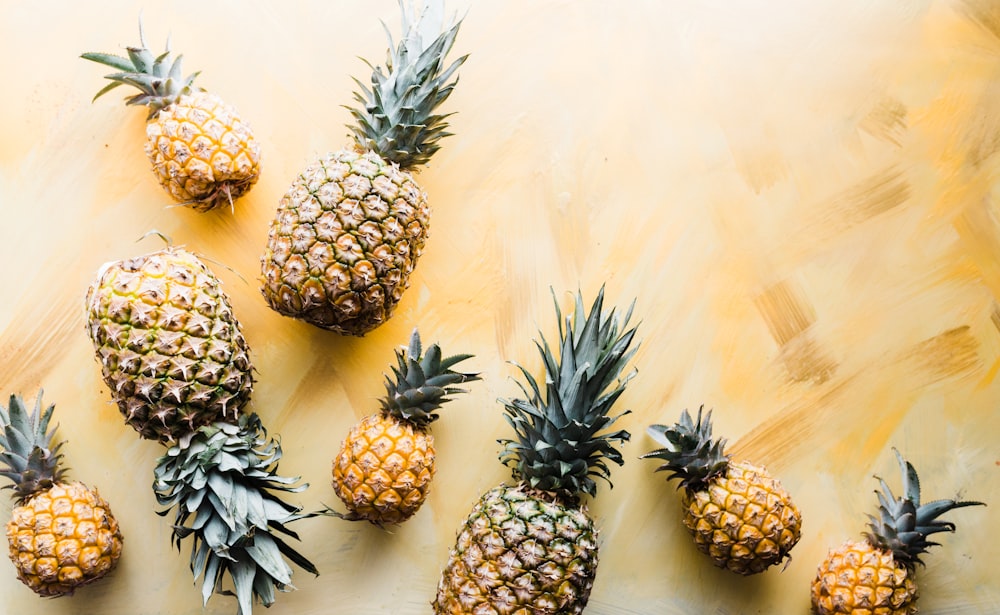 pineapples on brown surface