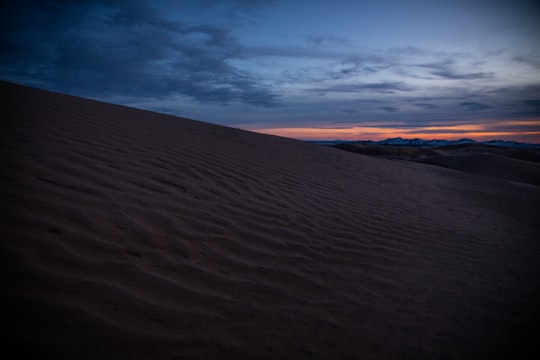 desert sand under orange sky in Little Sahara National Recreation Area United States