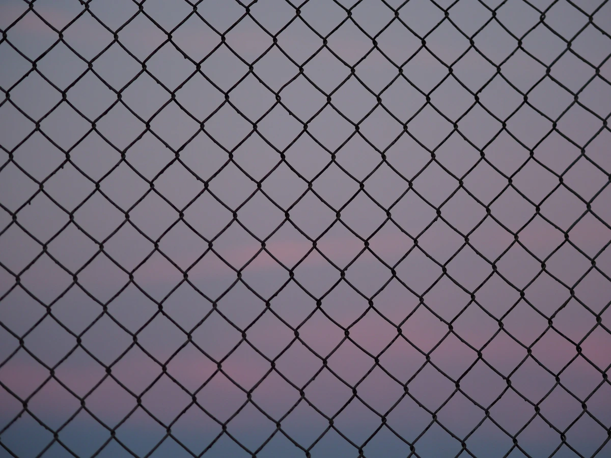 Placeholder — Weldmesh panels stacked alongside the fence line