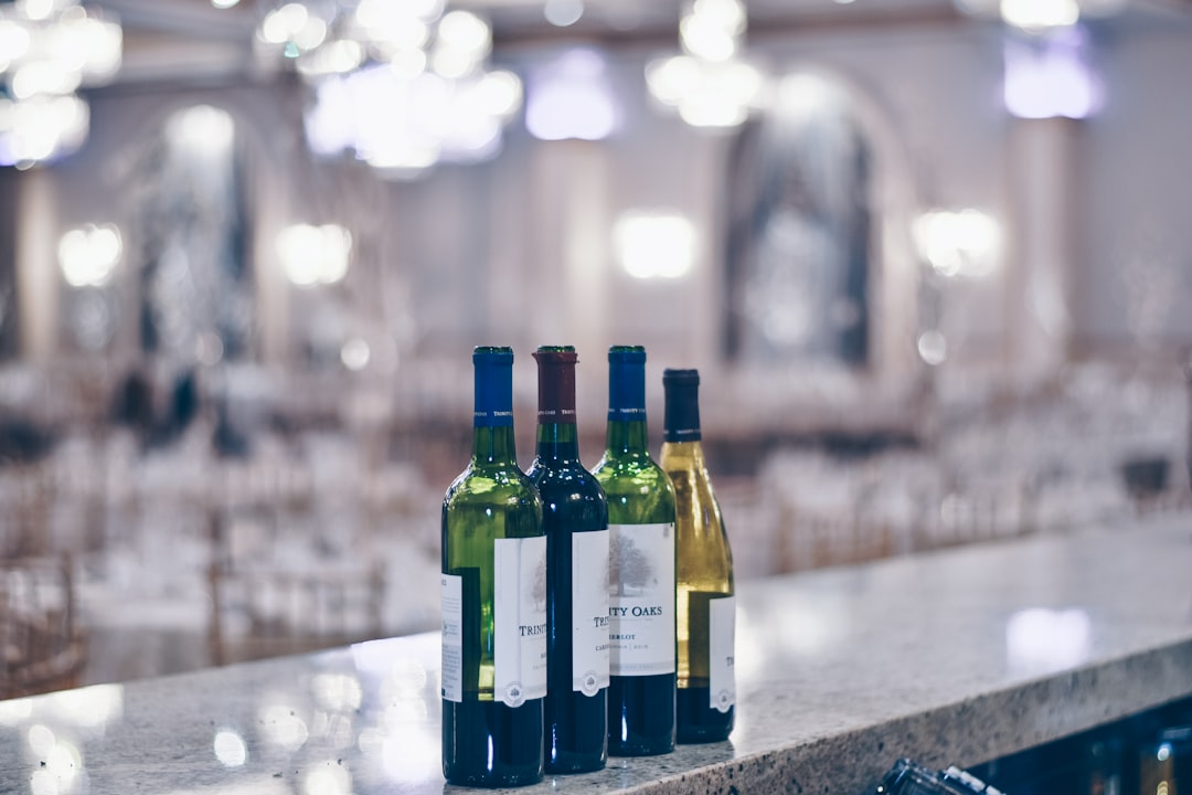 shallow focus photography of wine bottles,