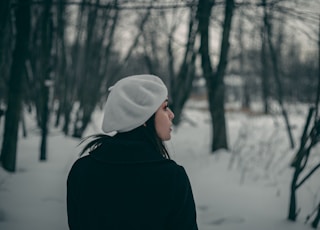 woman looking to the left standing on snow