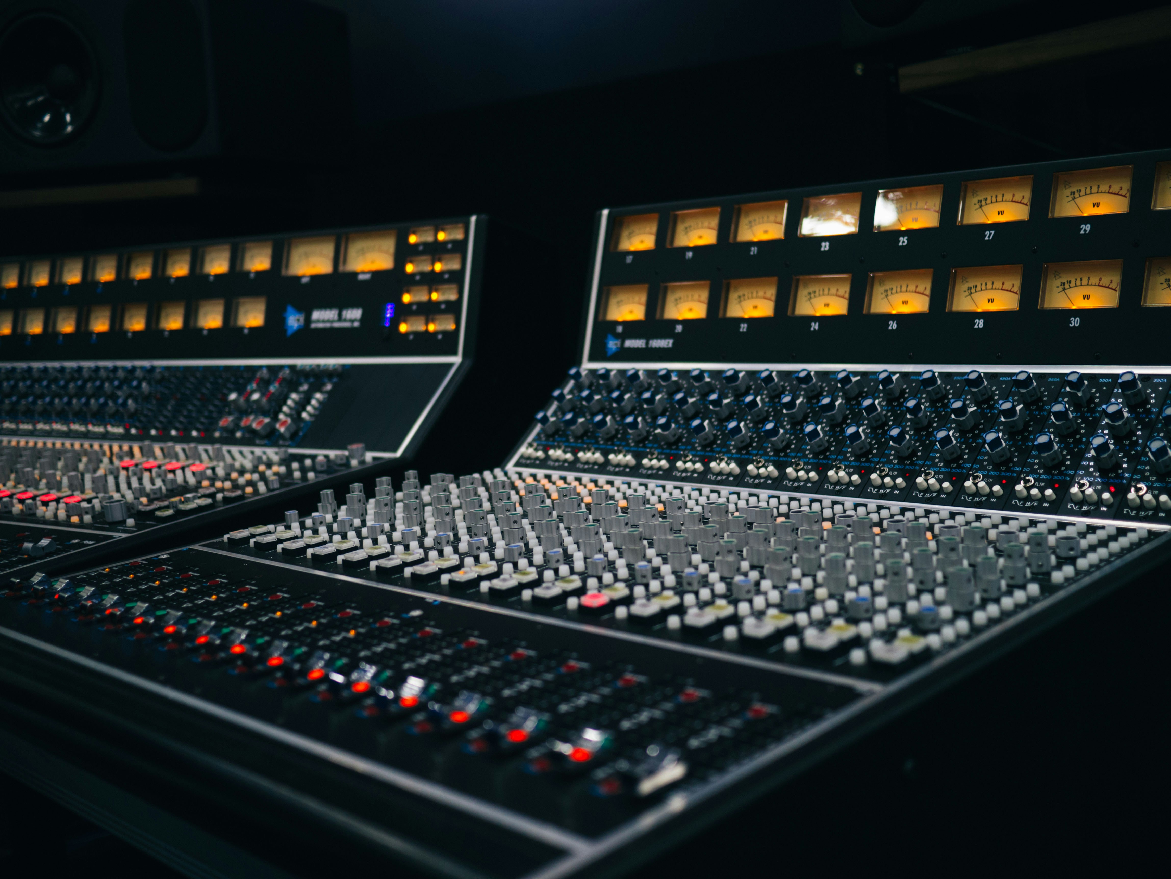 Close up of a sound board, recording modern royalty free music.
