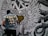 A person wearing a denim jacket with a bold gold and white text statement on the back stands in front of a black and white mural. The mural features intricate designs of wings, tentacle-like patterns, and a central heart shape partially filled with gold, all surrounding a peace symbol.