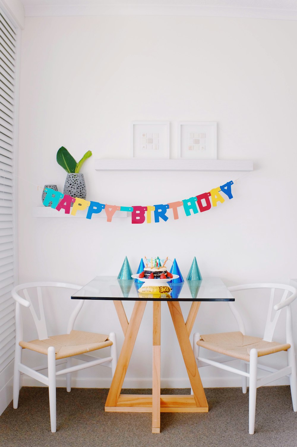 brown and white pub set and happy birthday hanging decor inside room