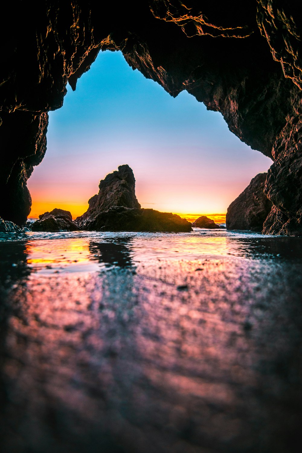 body of water under rock