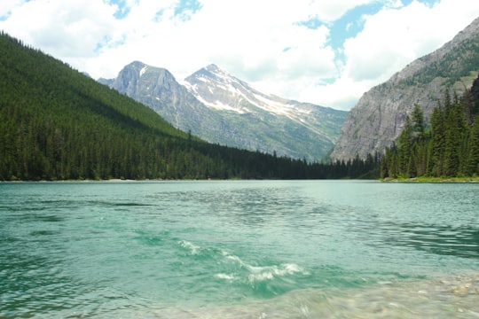 calm body of water near mountain in Glacier National Park United States