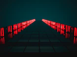 black pathway between red LED light rails