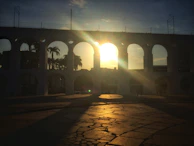 Sunset over a completed aqueduct project showcasing clean lines and solid construction.
