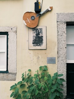 An old black-and-white photo of the 1972 Derry tragedy memorial, with a folk singer playing nearby.
