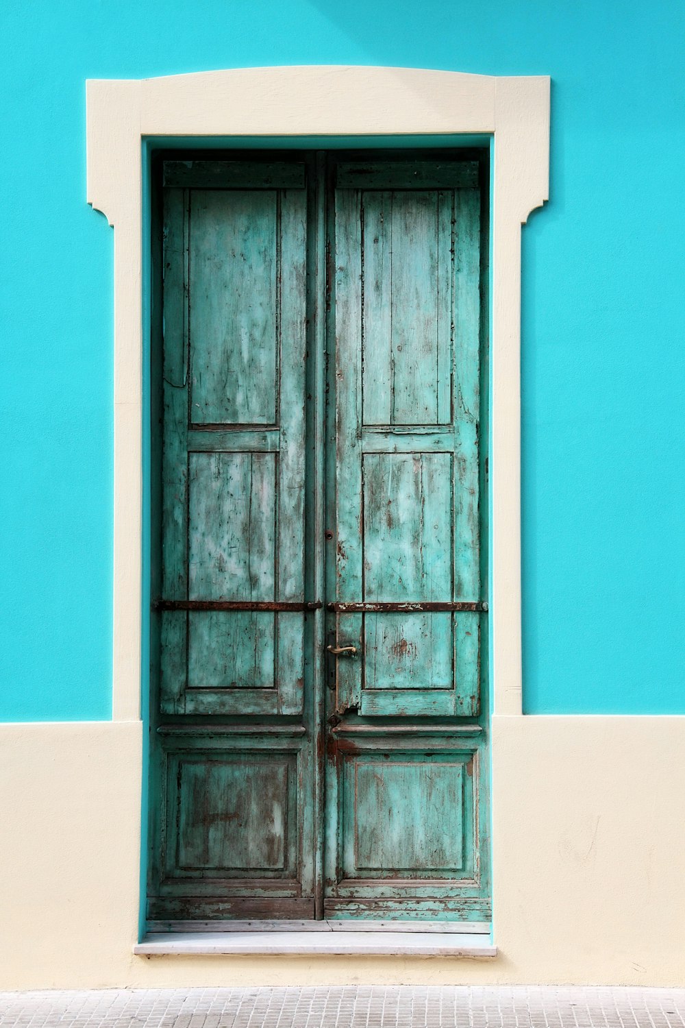 teal wooden door closed