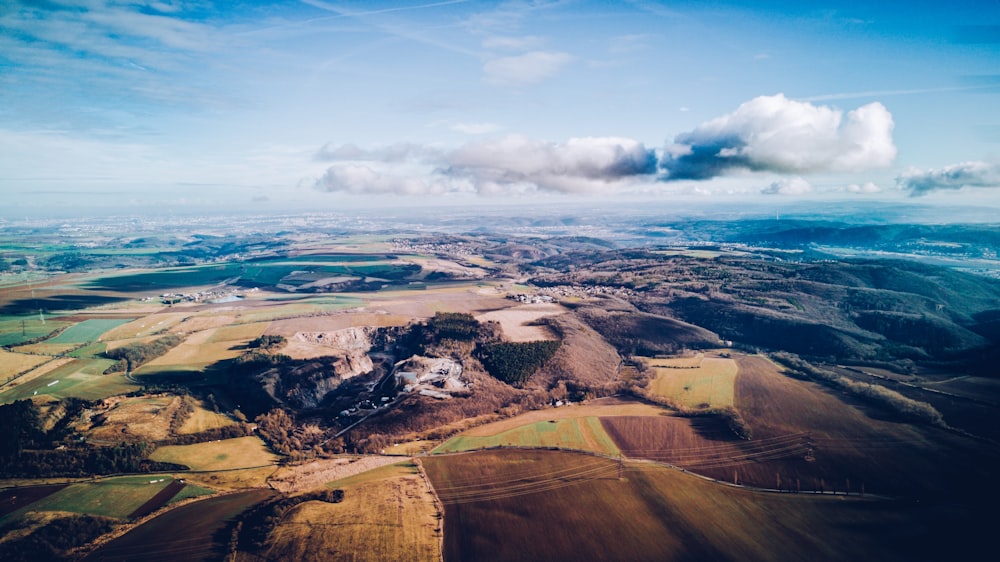 aerial photography of mountains under blue sky