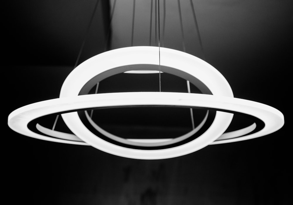 a circular light fixture hanging from a ceiling