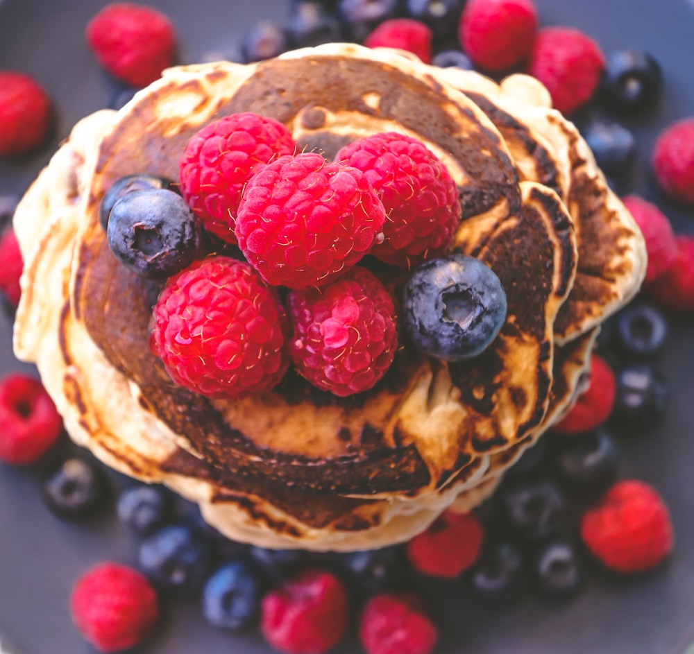 brown pie with red and blue berries