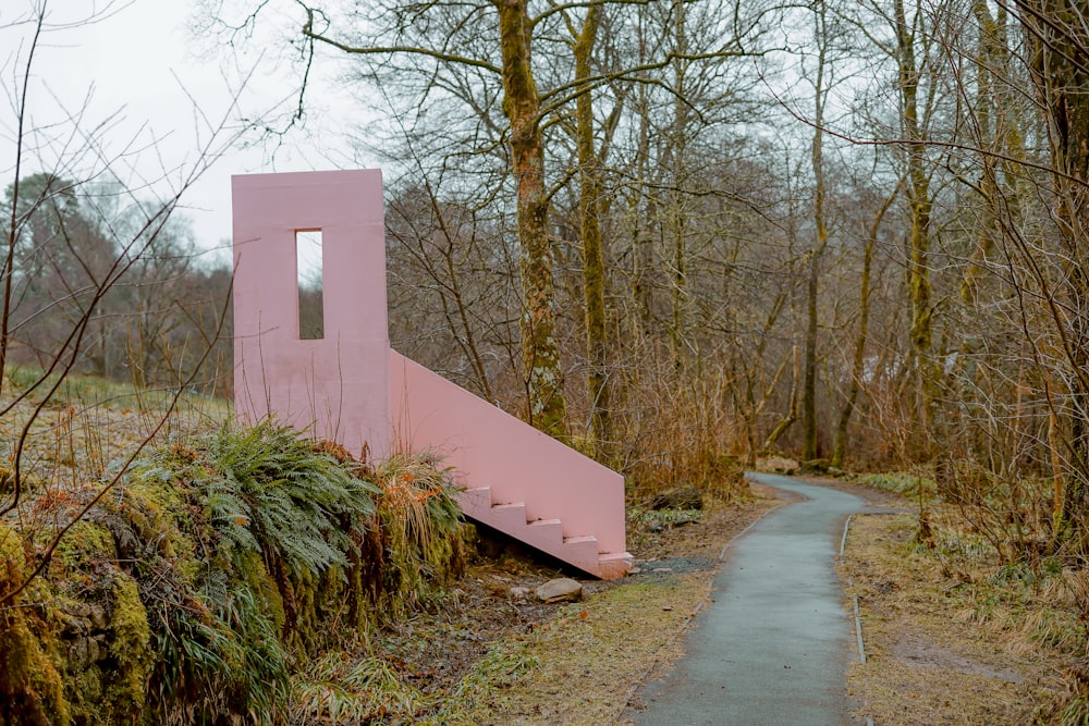 pink painted stairs in forest