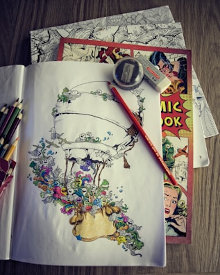 A collection of custom illustrations laid out on a table.