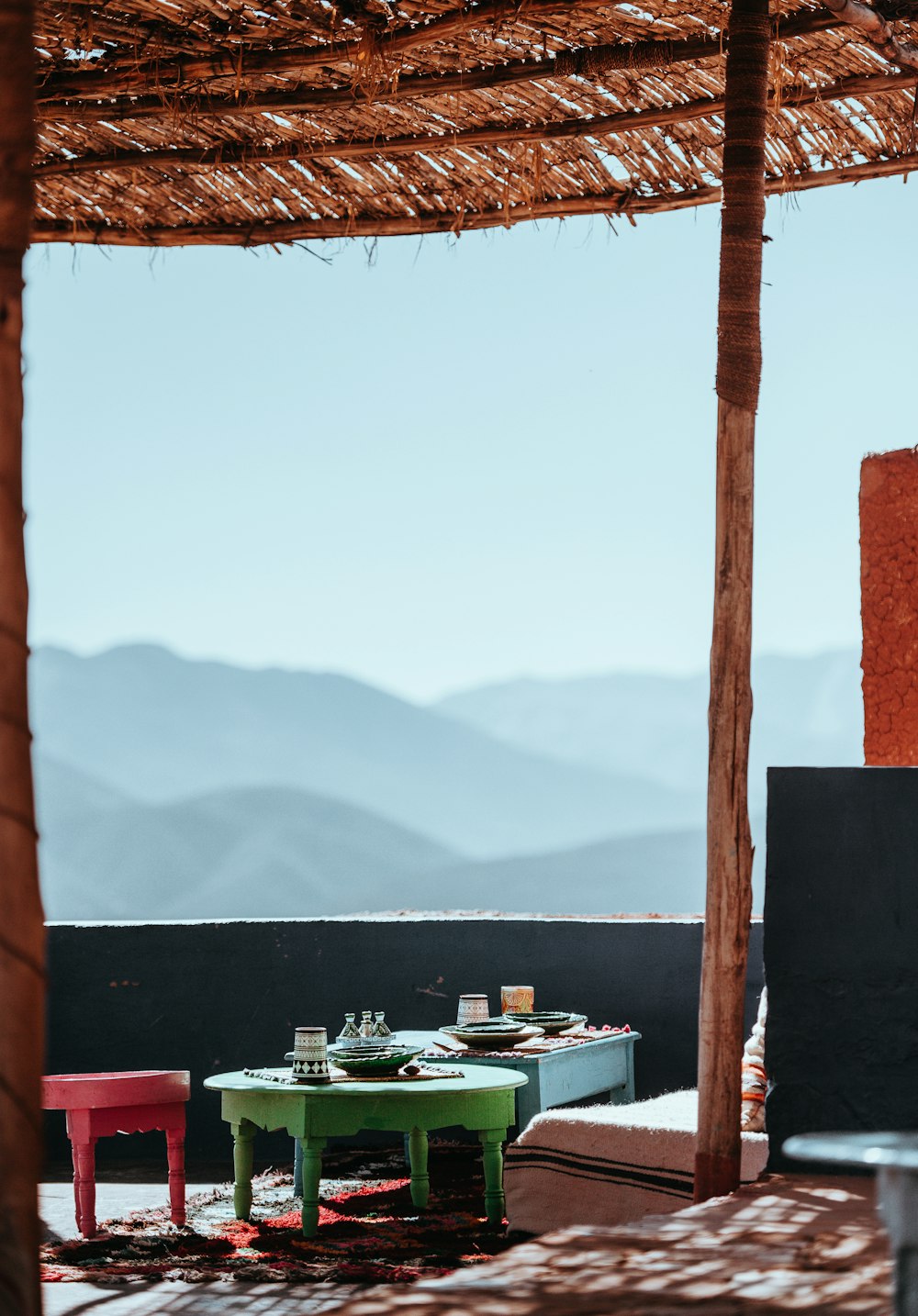 green table beside red and blue tables