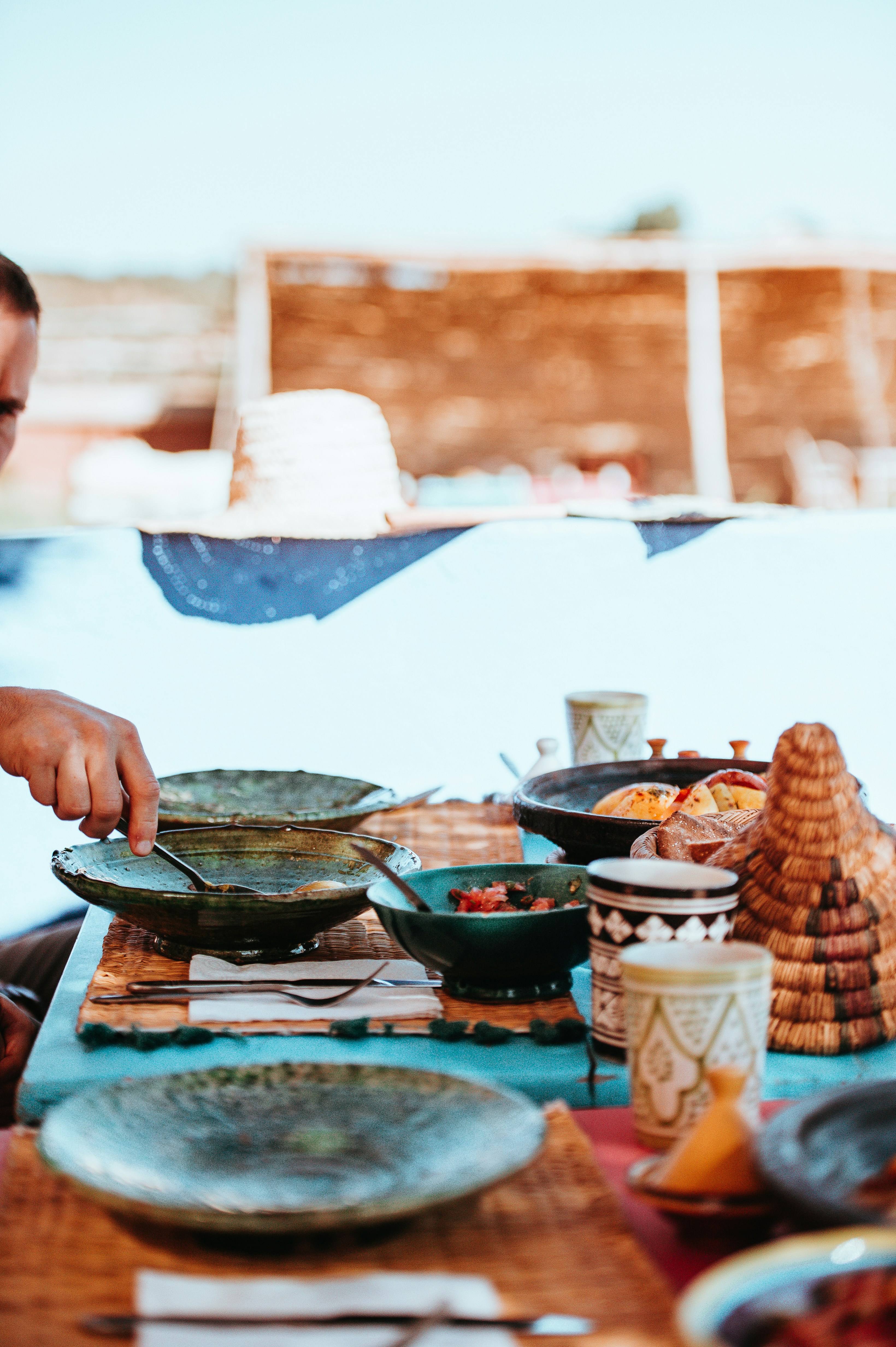 man cooking on gray wok during daytime