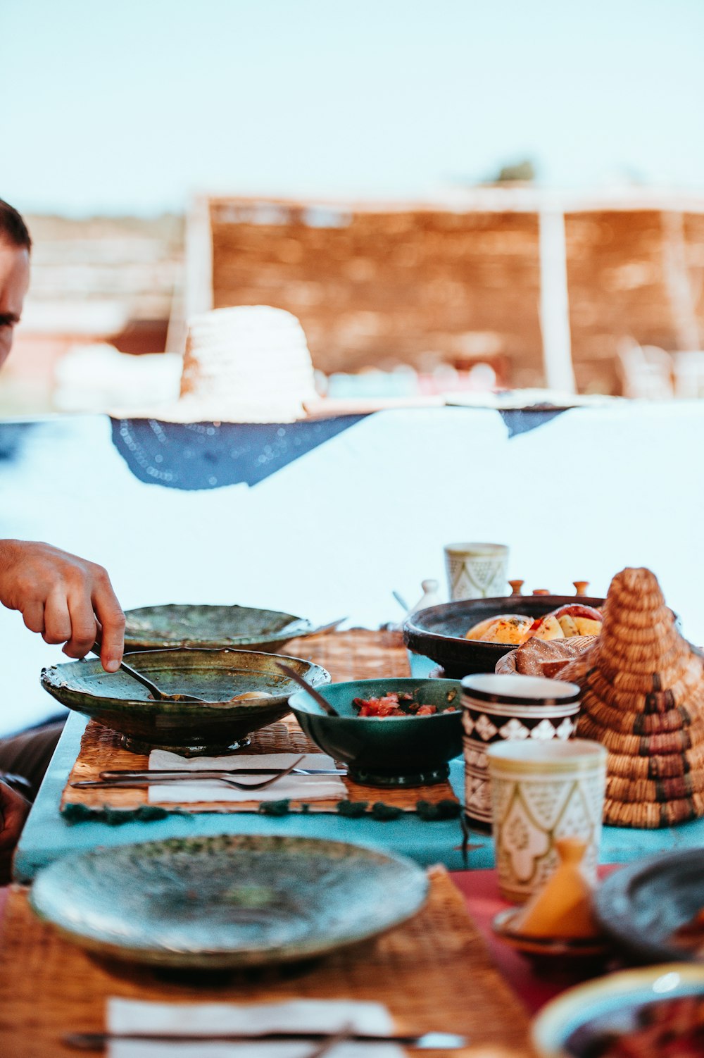 man cooking on gray wok during daytime