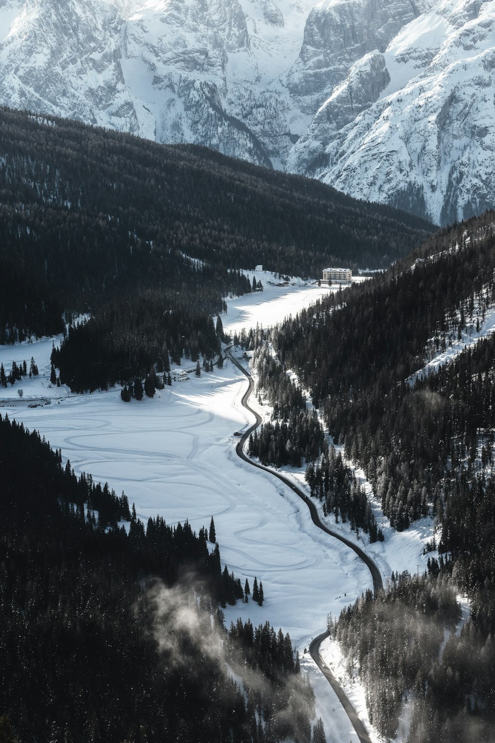 birds eye view of road in between mountains