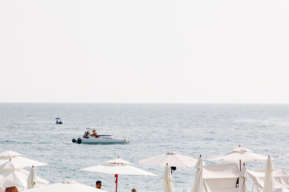 white boat on body of water