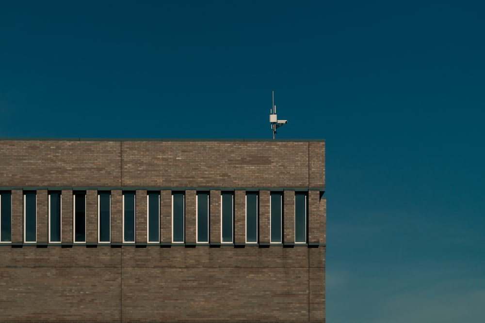 photo of white stand on brown building