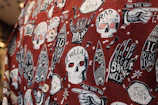 Close-up of a bold skull rock graphic t-shirt in black with red accents.