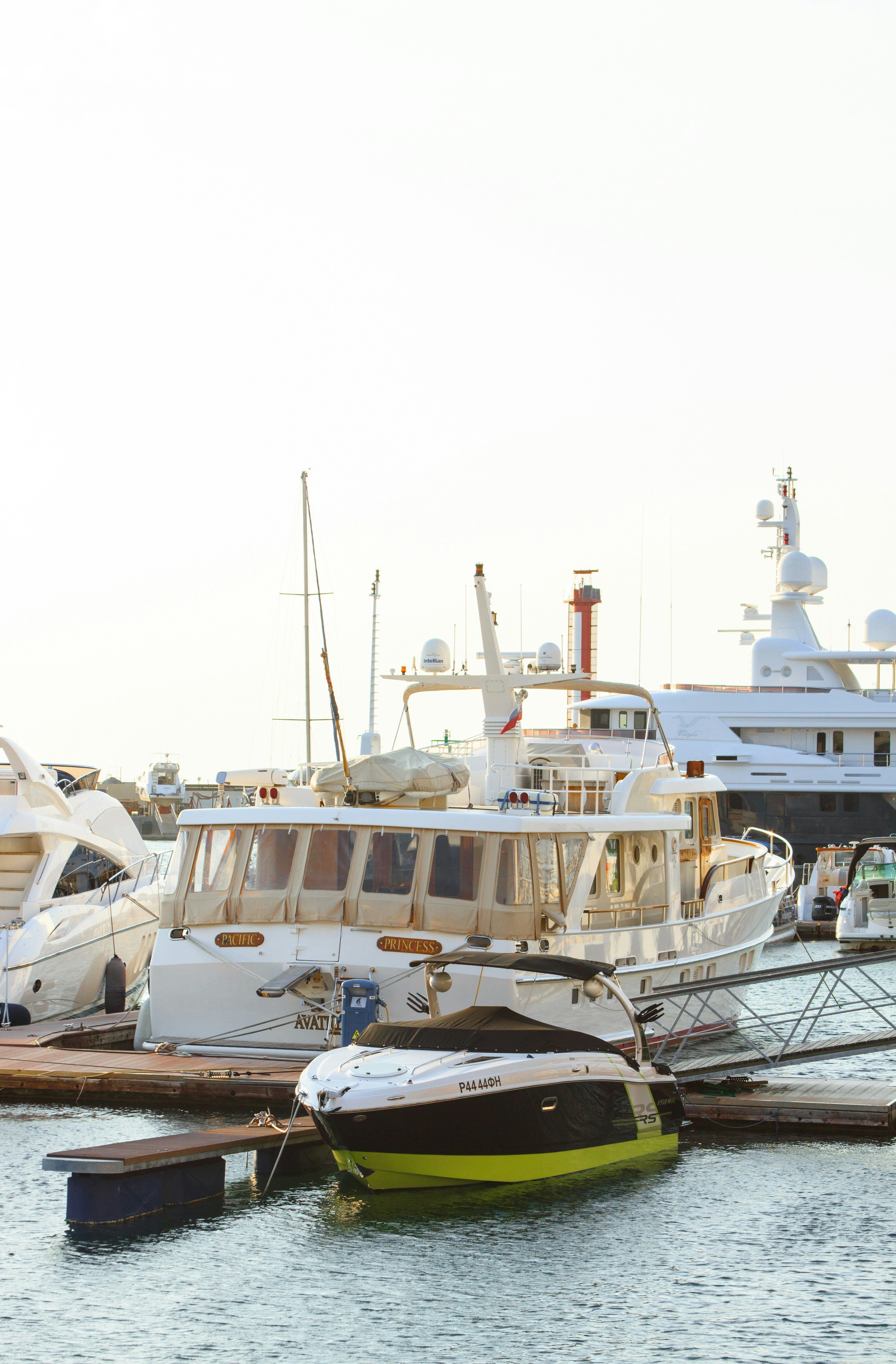 Charter yacht tied up at a marina dock on a clear day