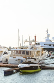 A nautical boat docked at a marina, showcasing Faster's rental fleet