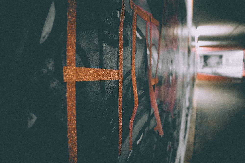 a close up of a wall with graffiti on it