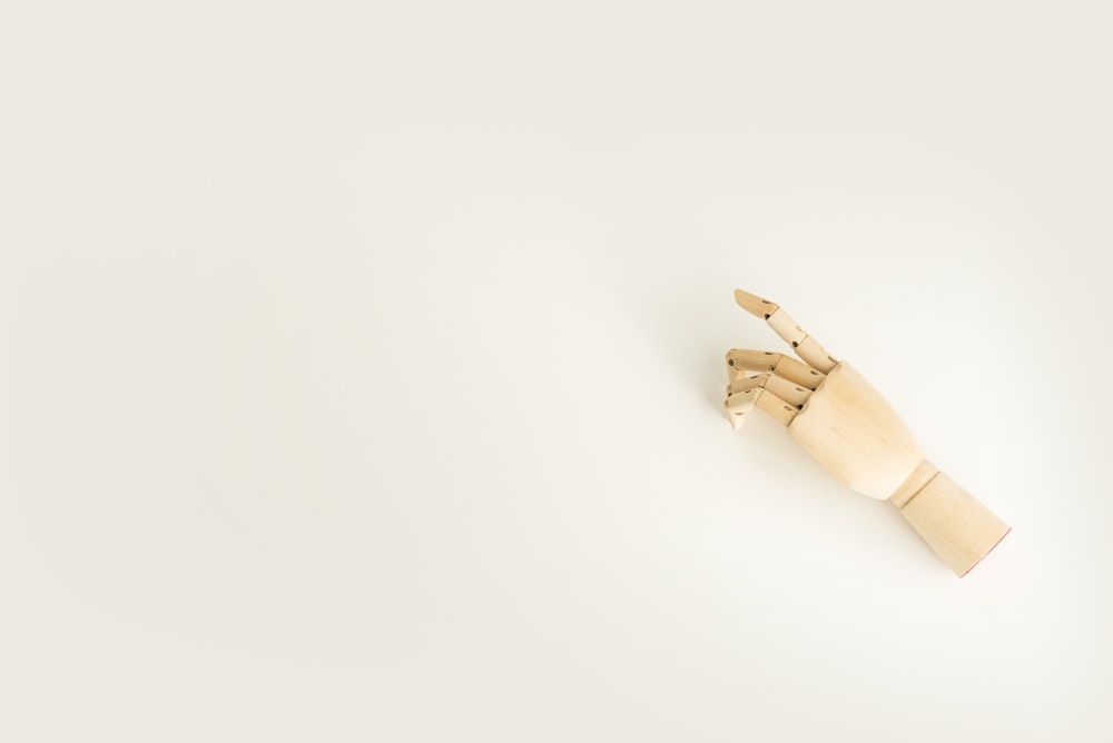 brown wooden hand mannequin