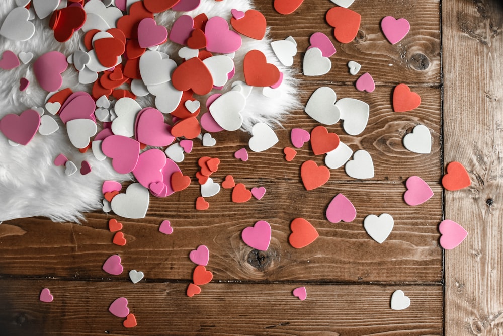 A red heart and three smaller hearts on a white background photo – Free 3d  Image on Unsplash