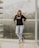 woman leaning on glass wall