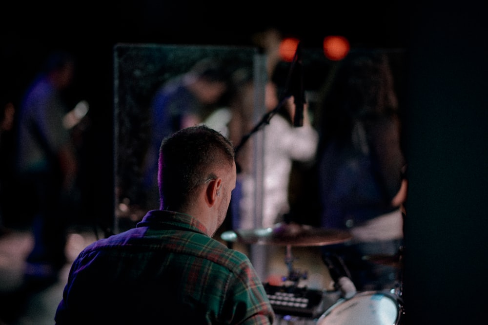 selective focus photography of man facing crowd