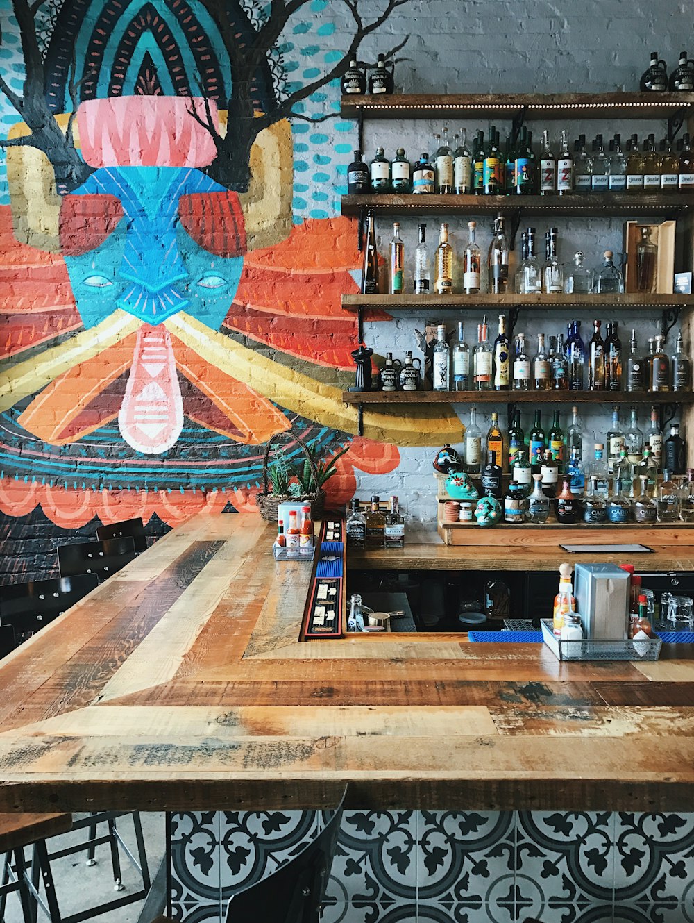 assorted bottles on wooden rack