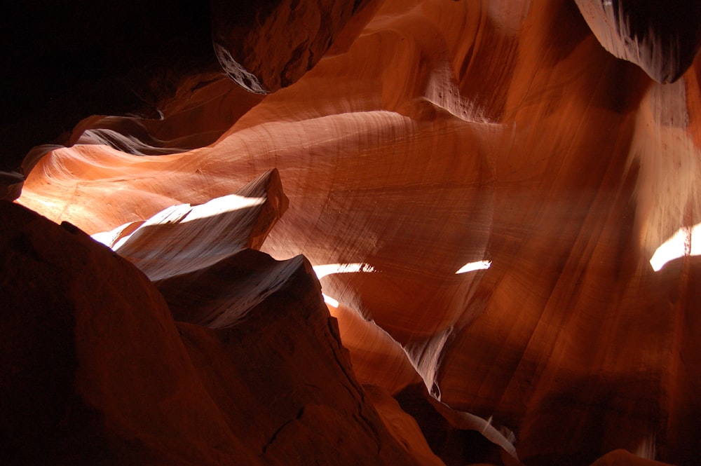 the light shines through the rocks in the canyon