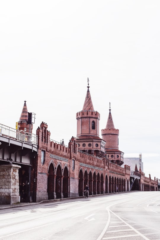 brown concrete castle under clear sky in Oberbaum Bridge Germany