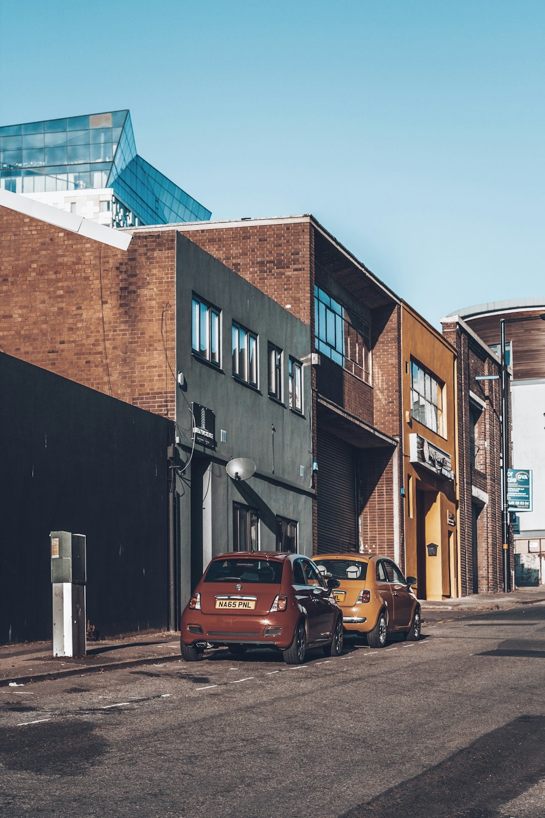 two hatchback beside wall