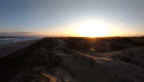 Sunset view over the dunes near Burgh Haamstede with warm golden light.