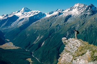 man standing on cliff