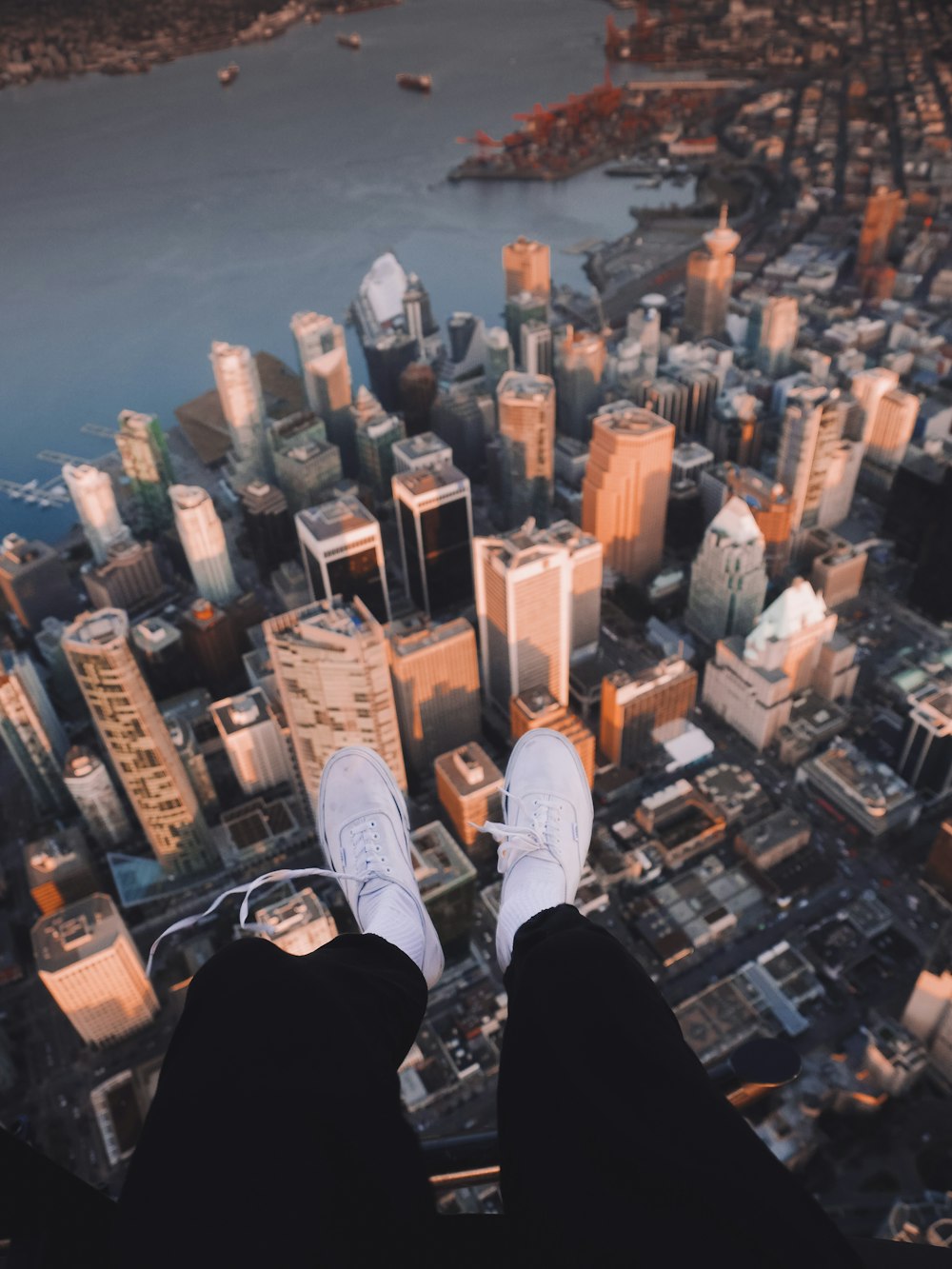 person's sitting on top of building