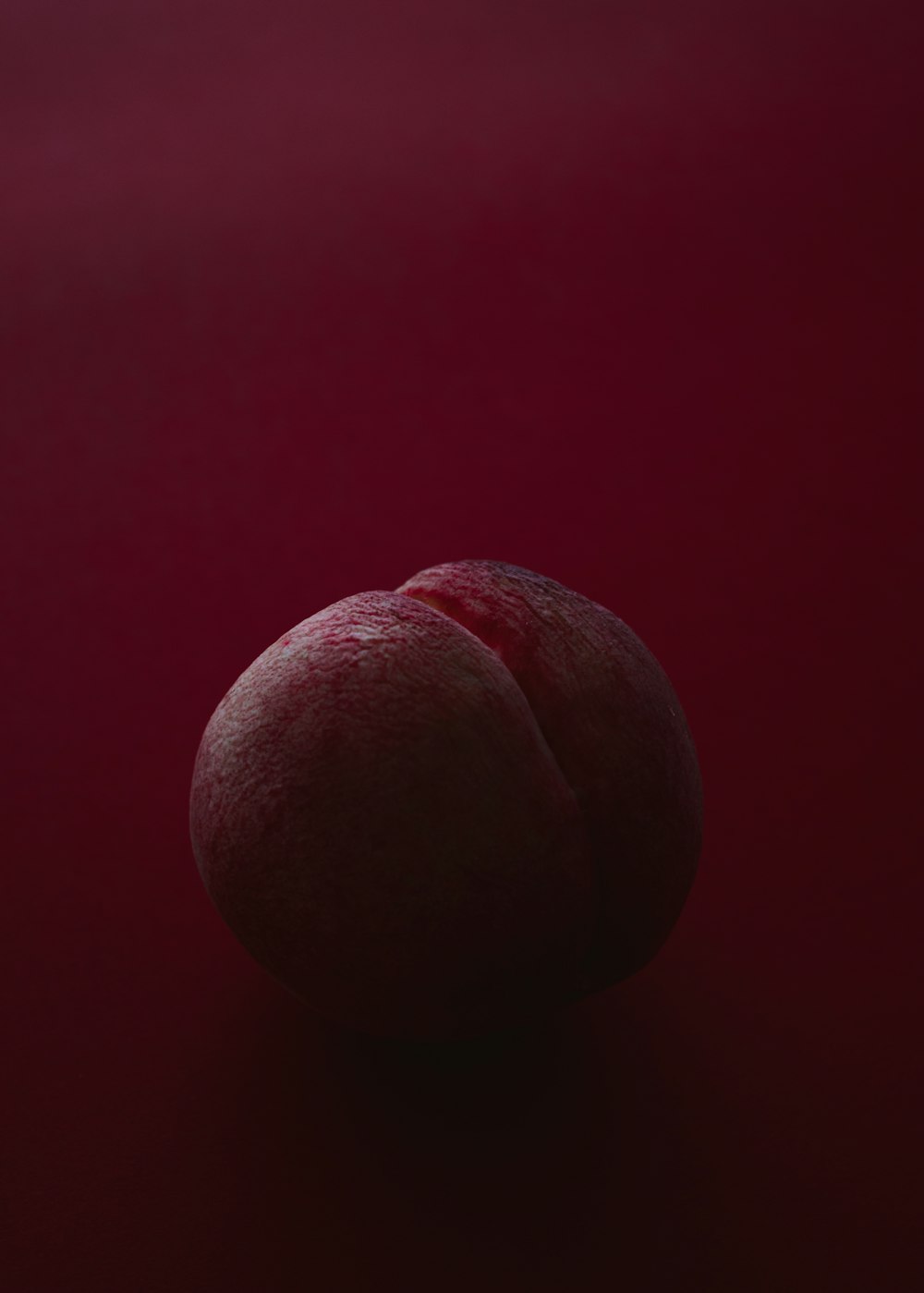 brown ball on red surface