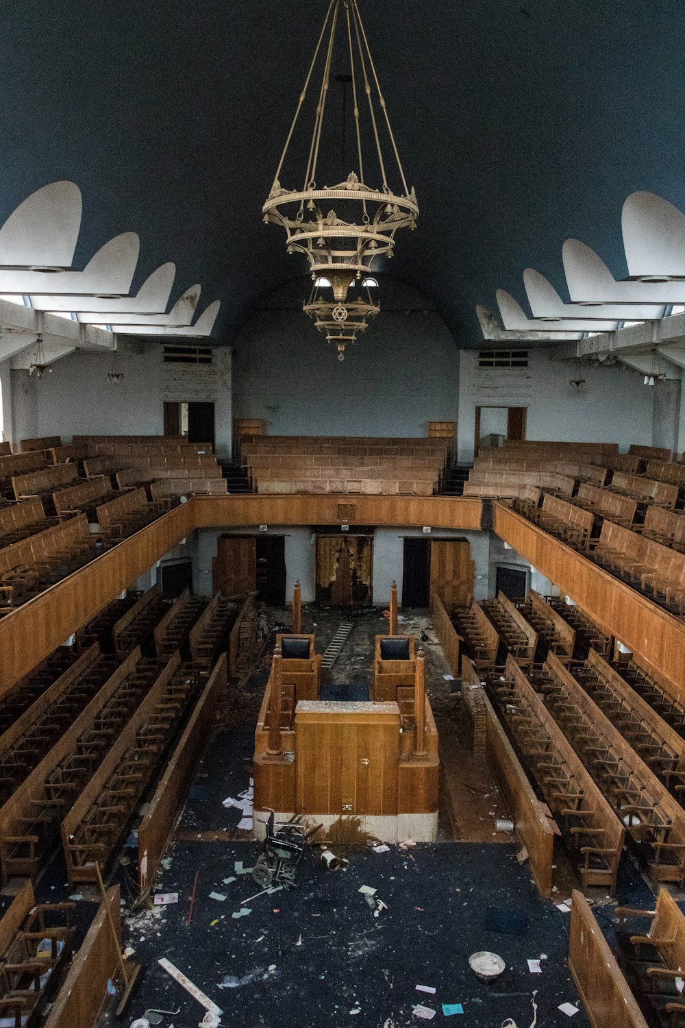 aerial view of brown wooden room with chandelier