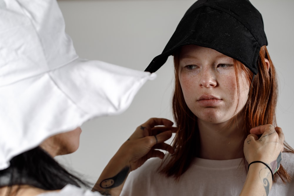 woman touching woman's hair