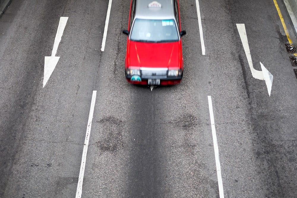 car traversing road at daytime