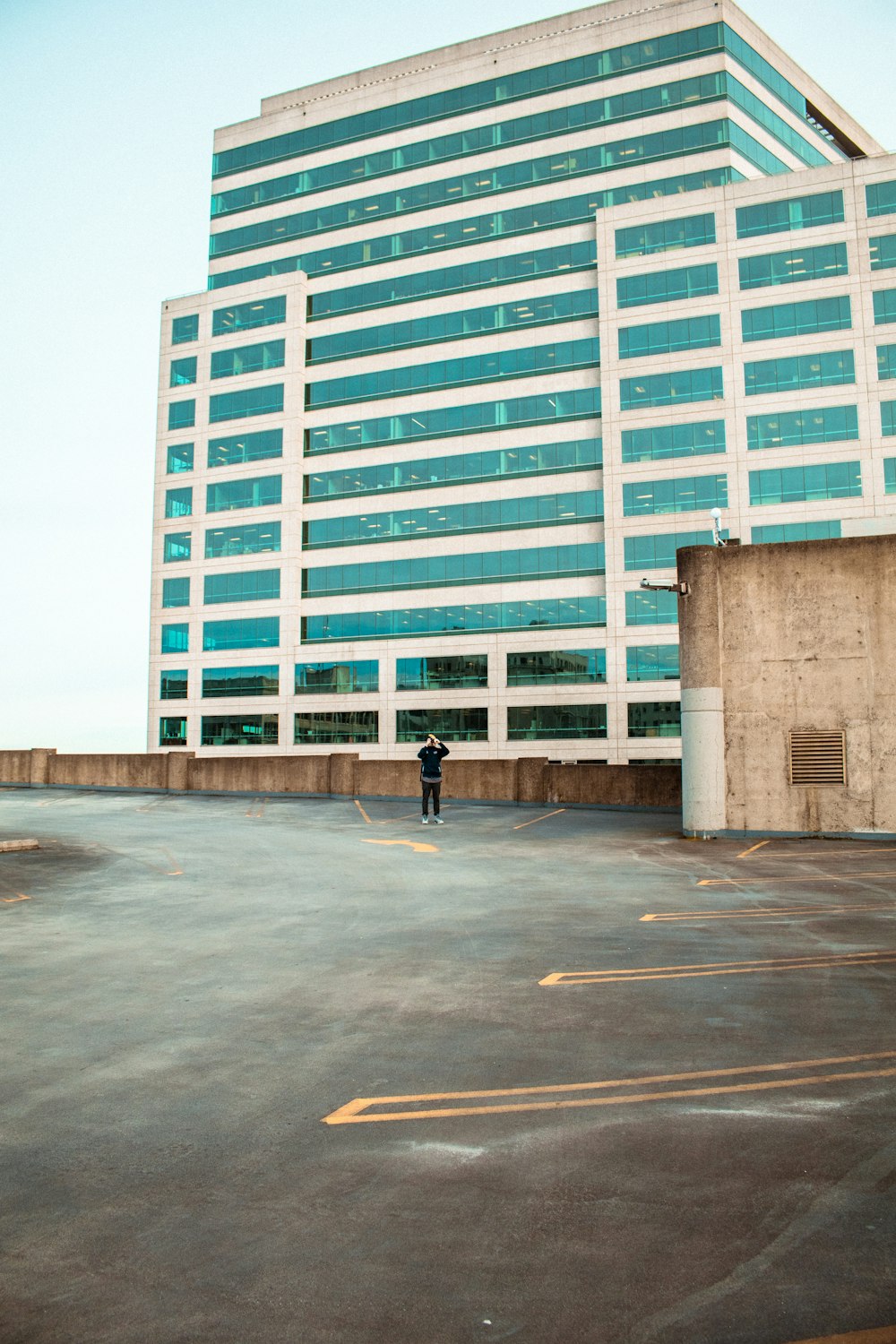 person standing on building roof top