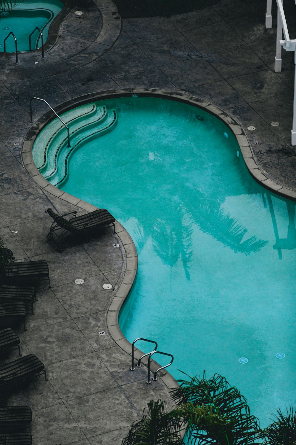 swimming pool during daytime in aerial view photography
